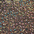 A flat sample of vogue stretch netting sequin in the color black.