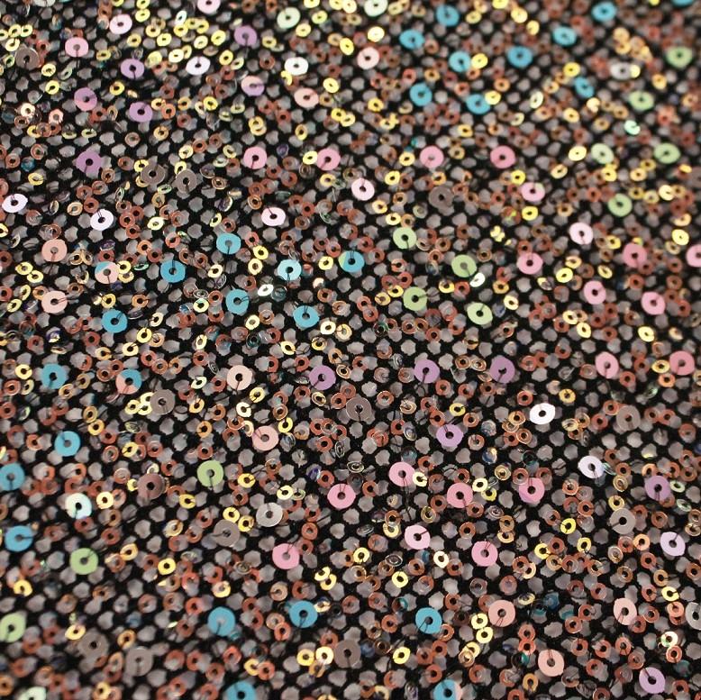 A flat sample of vogue stretch netting sequin in the color black.
