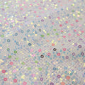 A flat sample of vogue stretch netting sequin in the color white.