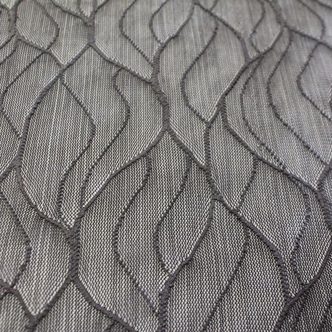 A flat sample of wavy stretch mesh in the color charcoal.
