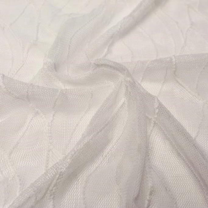 A swirled piece of wavy stretch mesh in the color white.