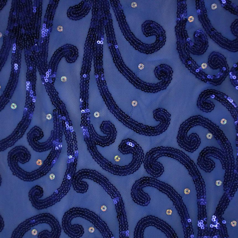 A flat sample of whirling motion stretch mesh sequin in the color sapphire.