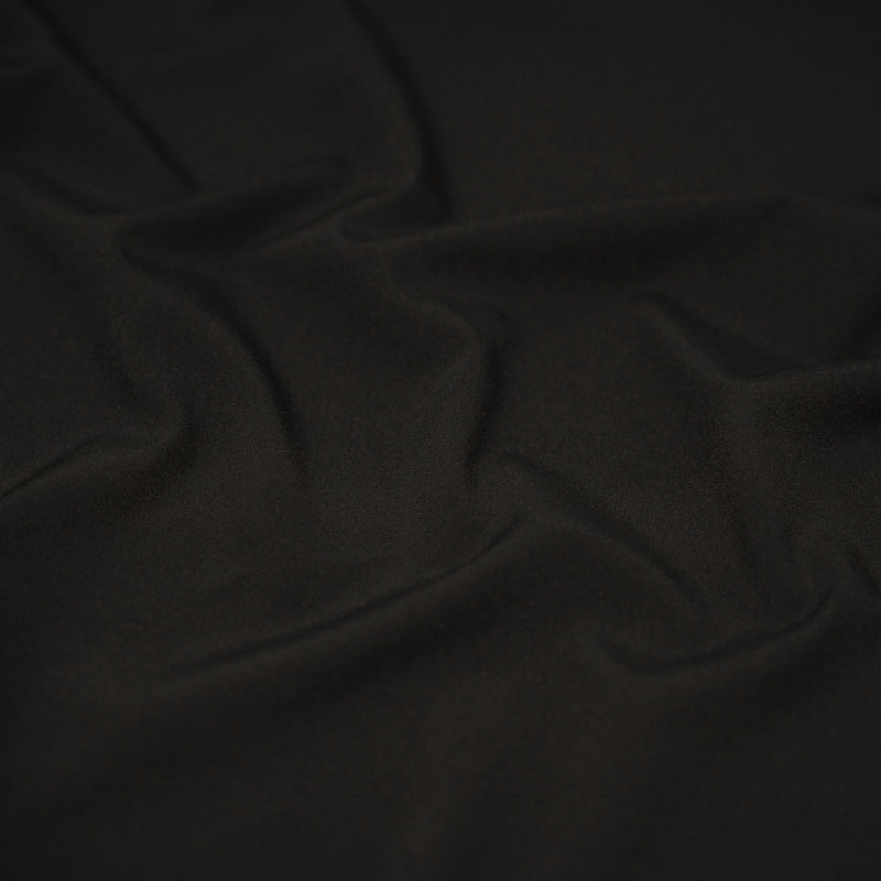 Detailed shot of Wipeout Woven Polyester Spandex in the color black