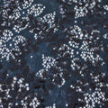A flat sample of wisteria stretch lace sequin in the color deep sea.
