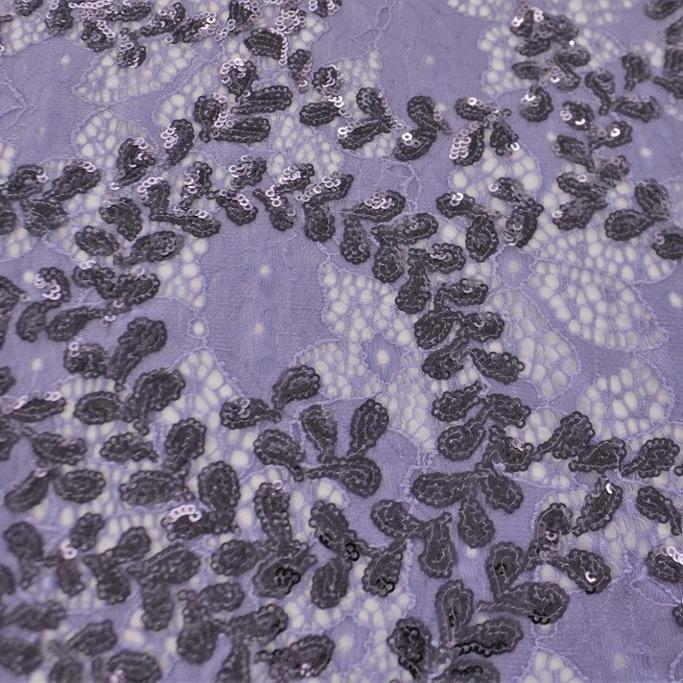A flat sample of wisteria stretch lace sequin in the color iris.
