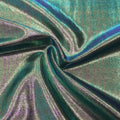 A swirled sample of wizard foiled spandex in the color charcoal-pink.