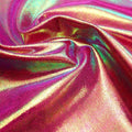 A swirled sample of wizard foiled spandex in the color berry green.
