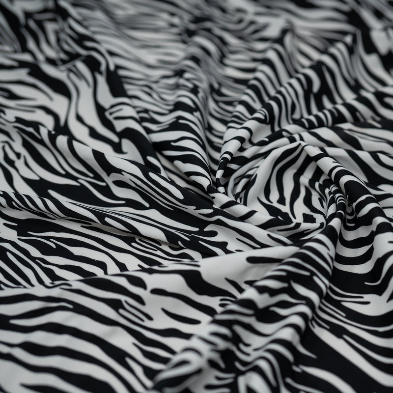 A swirled piece of Zebra Nouveau Printed Spandex