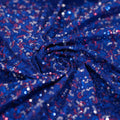 A swirled sample of Zsa Zsa Spandex Sequin in Sapphire/Red/Silver/Royal.