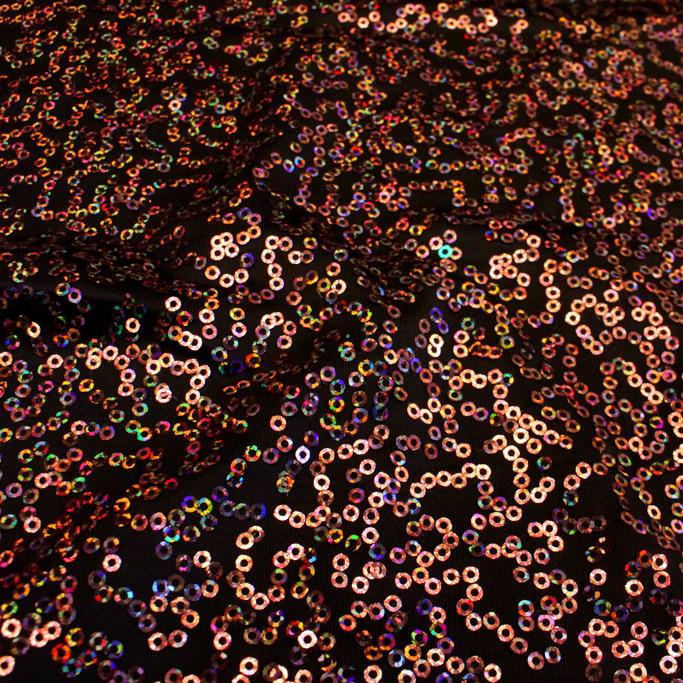 A swirled sample of zsa spa spandex sequin in the color dark chocolate-rose.