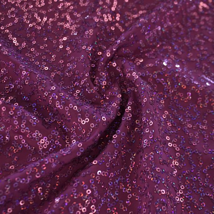 A swirled sample of zsa spa spandex sequin in the color magenta-magenta.