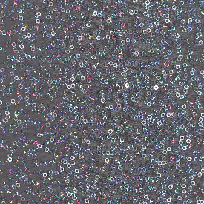 A swirled sample of zsa spa spandex sequin in the color steel-silver.