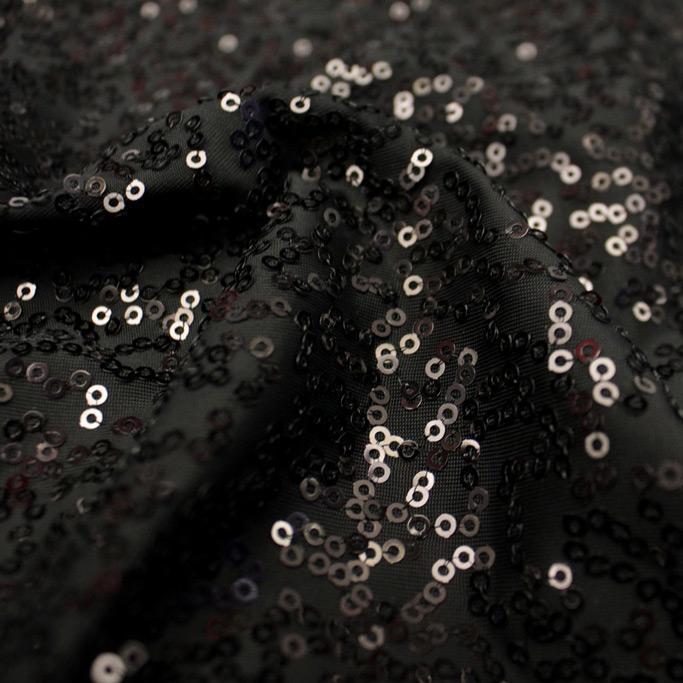 A flat sample of zsa zsa spandex sequin in the color black.
