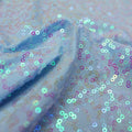 A swirled sample of zsa zsa pearl spandex sequin in the color pearl blue.