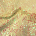 A swirled sample of zsa zsa pearl spandex sequin in the color pearl ivory.