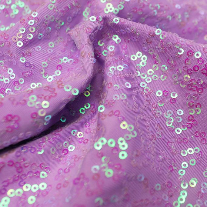 A swirled sample of zsa zsa pearl spandex sequin in the color pearl lavender.