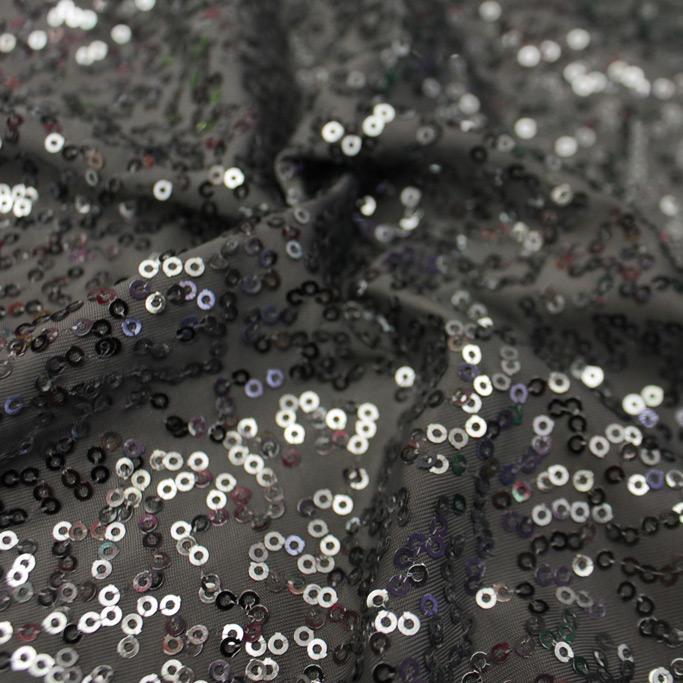 A flat sample of zsa zsa spandex sequin in the color steel-gunmetal.