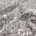 A flat sample of zsa zsa spandex sequin in the color white-silver.