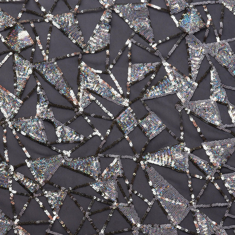 A flat sample of Flaunt It Stretch Mesh Sequin with black colored mesh and silver sequin.