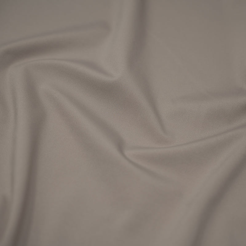 A swirled sample of ecotechflex recycled polyester spandex in the color pewter