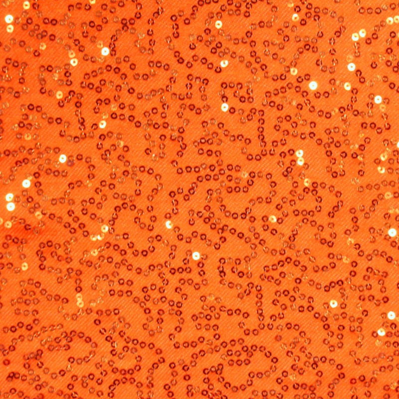 A flat sample of edgy stretch twill sequin in the color orange.