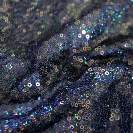 A swirled sample of flirt stretch mesh sequin in the color navy.