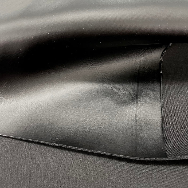 A folded sample of rider faux leather spacer in the color black.
