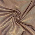 A swirled sample of ultra sheen metallic foiled power mesh with a dark chocolate brown mesh and copper foil available at Blue Moon Fabrics.