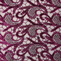 A flat sample of Milania foiled lace in the color fuchsia.