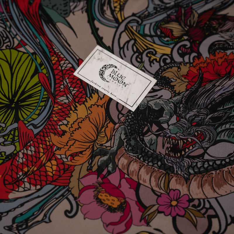 A flat sample of Japanese Dragon and Koi Fish on Floral Tattoo Printed Power Mesh with Blue Moon Fabrics logo